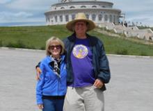 Sandy and Jim Delmonte at the statue of Genghis Khan — Mongolia.